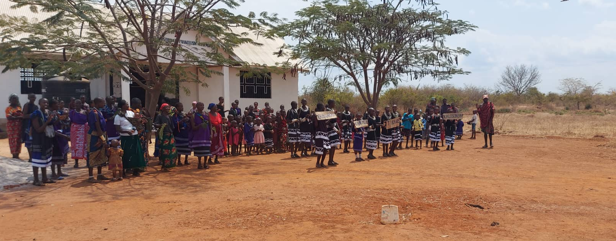 Masai community welcoming the team (including Neil and Nick) in 2022